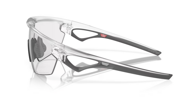 Sluneční brýle OAKLEY Sphaera Matte Clear Frame/Clear To Black Iridium Photochromic Lenses