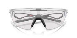 Sluneční brýle OAKLEY Sphaera Matte Clear Frame/Clear To Black Iridium Photochromic Lenses